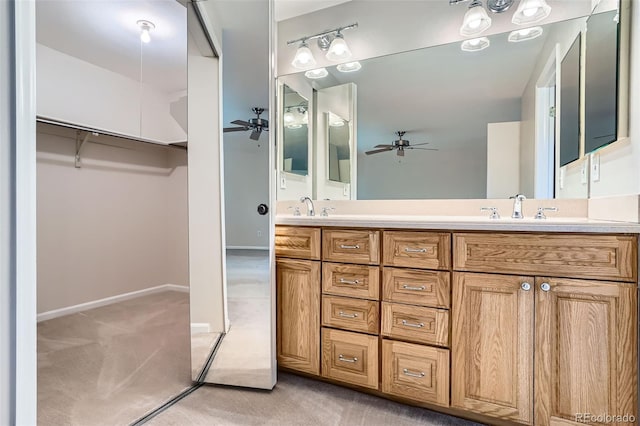4780 W 102nd Pl, Westminster, CO 80031 - bathroom with a ceiling fan, double vanity, and a walk in closet