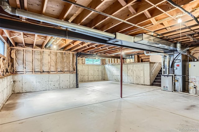 4780 W 102nd Pl, Westminster, CO 80031 - below grade area featuring water heater, stairs, and heating unit