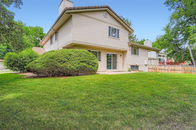 4780 W 102nd Pl, Westminster, CO 80031 - back of house featuring a chimney and a patio area