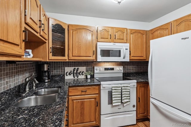350 S Clinton St Unit 9C, Denver, CO 80247 - kitchen featuring white appliances, a sink, tasteful backsplash, and dark stone counters