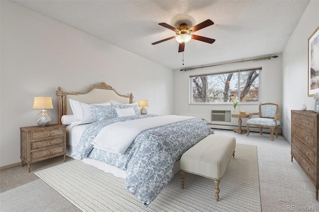 350 S Clinton St Unit 9C, Denver, CO 80247 - bedroom featuring carpet floors, an AC wall unit, ceiling fan, and a textured ceiling
