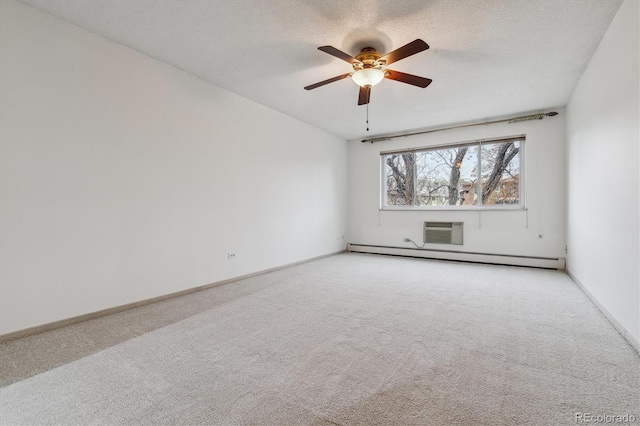 350 S Clinton St Unit 9C, Denver, CO 80247 - spare room featuring carpet floors, a ceiling fan, a baseboard radiator, an AC wall unit, and a textured ceiling