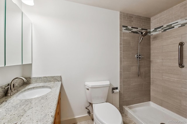 350 S Clinton St Unit 9C, Denver, CO 80247 - full bathroom featuring toilet, tiled shower, and vanity