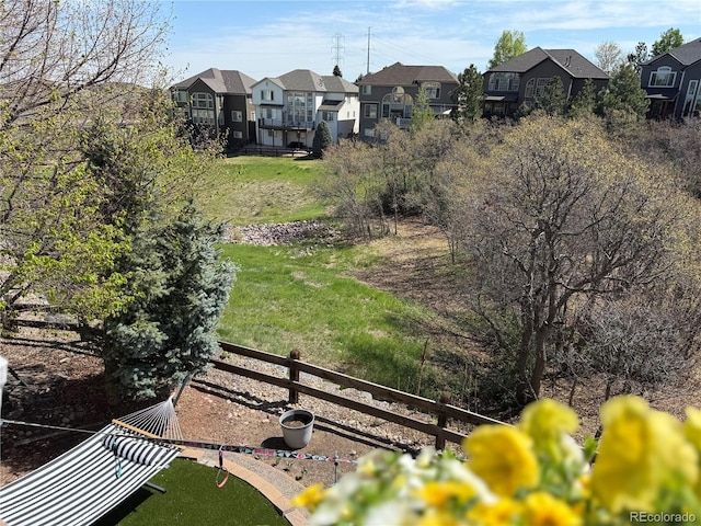 view of yard with a residential view and fence