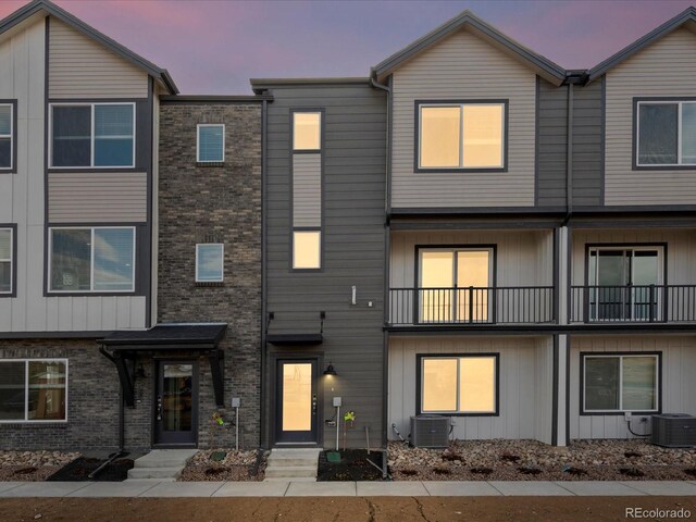 4761 Talley St, Morrison, CO 80465 - view of property with central AC unit and brick siding