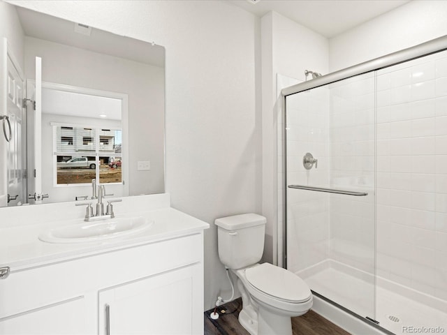 4761 Talley St, Morrison, CO 80465 - full bath with toilet, a shower stall, vanity, and wood finished floors