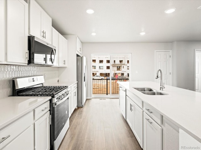 4761 Talley St, Morrison, CO 80465 - kitchen featuring stainless steel appliances, recessed lighting, light countertops, and a sink