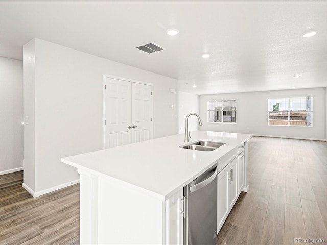 4761 Talley St, Morrison, CO 80465 - kitchen featuring open floor plan, light wood-style flooring, visible vents, dishwasher, and a sink