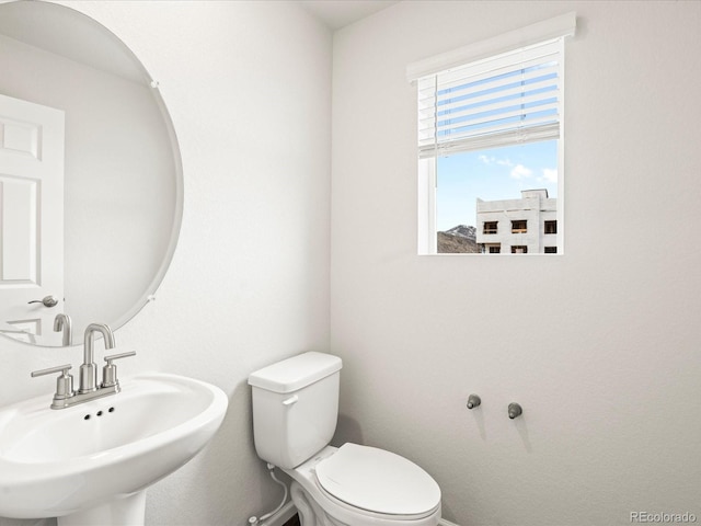 4761 Talley St, Morrison, CO 80465 - bathroom featuring toilet, a sink, and baseboards