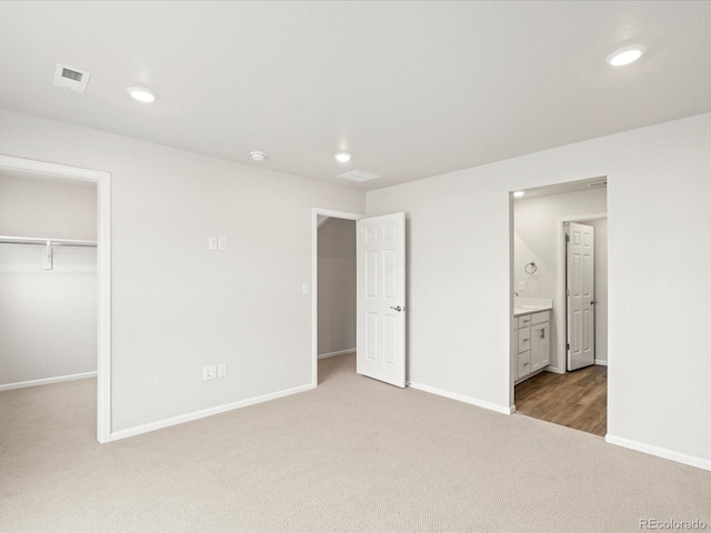4761 Talley St, Morrison, CO 80465 - unfurnished bedroom featuring visible vents, baseboards, carpet, a walk in closet, and recessed lighting