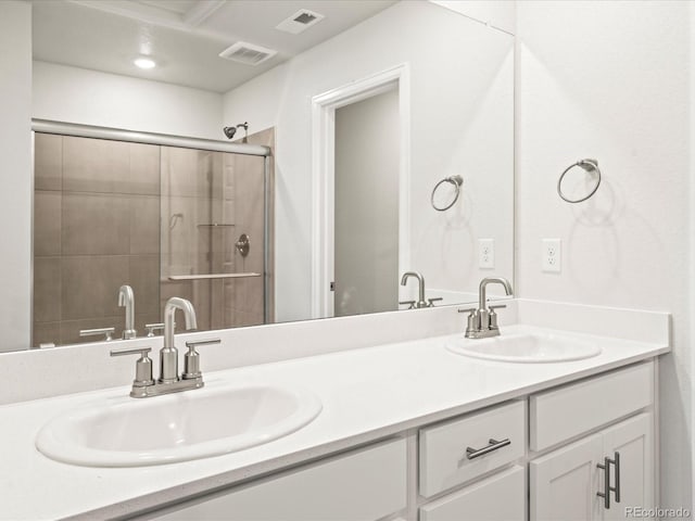 4761 Talley St, Morrison, CO 80465 - bathroom featuring a sink, visible vents, and tiled shower