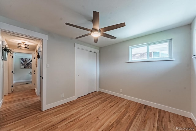 2274 S Cherry St, Denver, CO 80222 - unfurnished bedroom with baseboards, light wood-style floors, a closet, and a ceiling fan