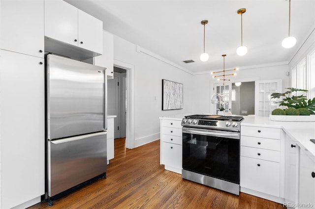 kitchen featuring stainless steel appliances, dark wood finished floors, visible vents, light countertops, and white cabinets