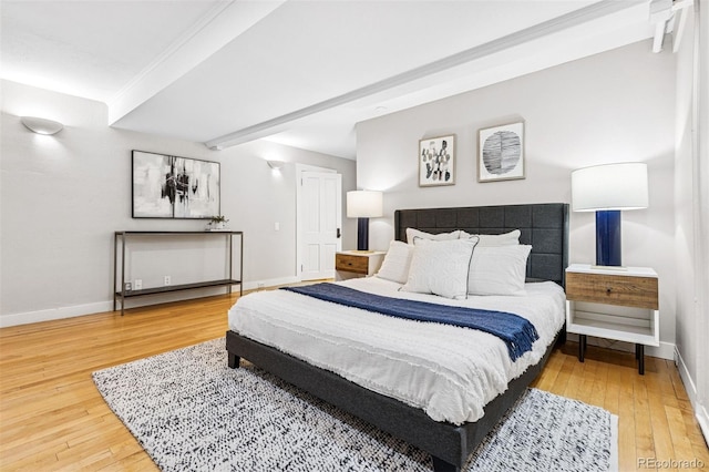 bedroom featuring baseboards and wood-type flooring