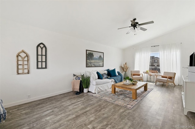 living room with vaulted ceiling, ceiling fan, wood finished floors, and baseboards