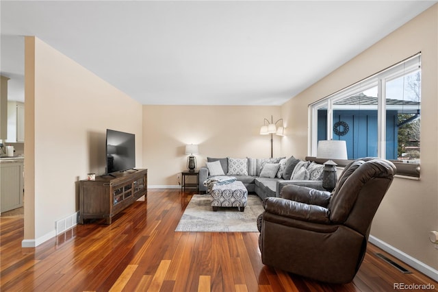 living room with dark hardwood / wood-style floors