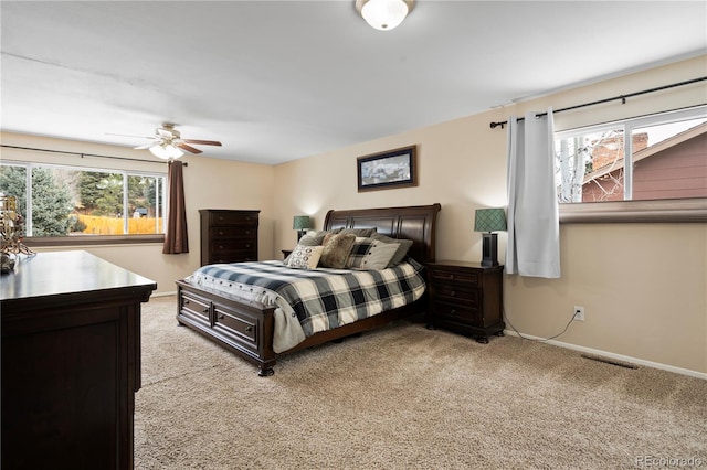 carpeted bedroom featuring ceiling fan