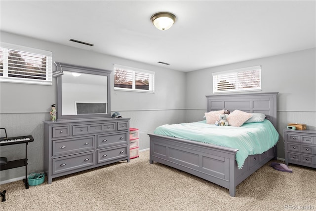 bedroom featuring light colored carpet