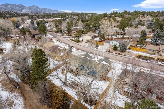 snowy aerial view featuring a mountain view