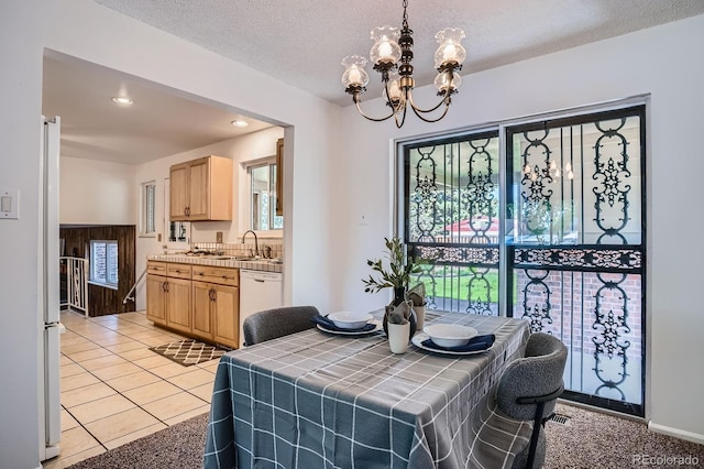 9270 Tennyson St, Westminster, CO 80031 - dining area with a chandelier, recessed lighting, a textured ceiling, and light tile patterned floors