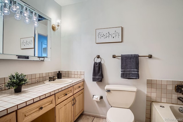 9270 Tennyson St, Westminster, CO 80031 - full bath featuring vanity, a bath, toilet, and tile patterned floors