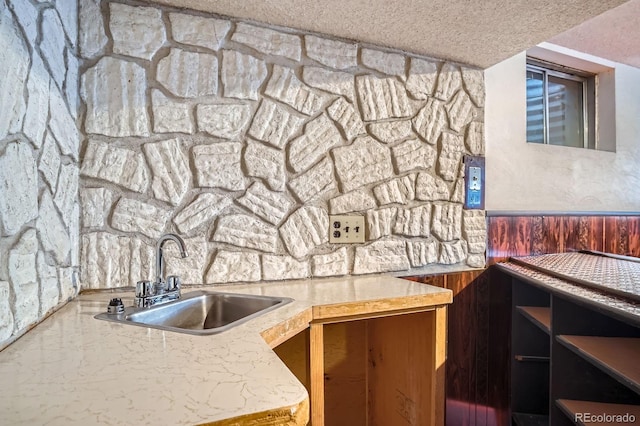 9270 Tennyson St, Westminster, CO 80031 - kitchen with a sink, a textured ceiling, and light countertops