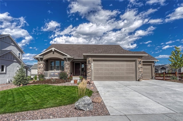 view of front of property with a garage and a front yard