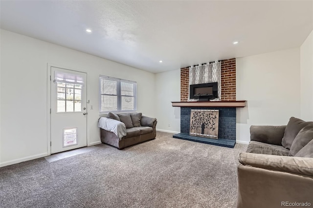 carpeted living room featuring recessed lighting, a fireplace, and baseboards