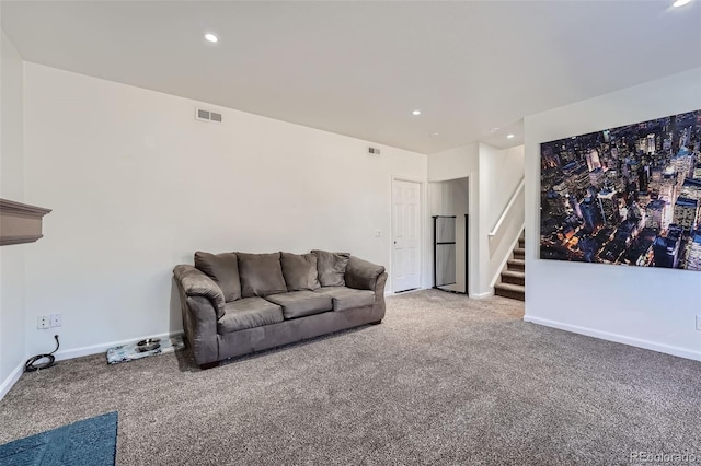 living room featuring visible vents, baseboards, carpet, stairs, and recessed lighting