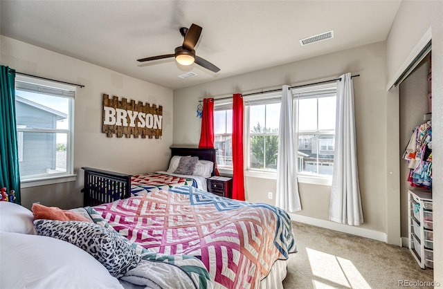 bedroom featuring a closet, ceiling fan, and carpet floors