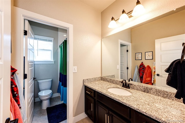 bathroom featuring a shower with curtain, vanity, toilet, and tile patterned floors