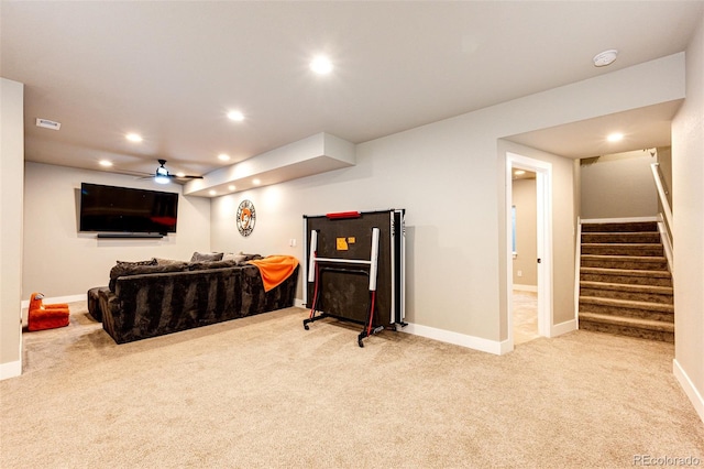 living room with ceiling fan and light colored carpet