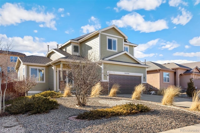 view of front of property with a garage and concrete driveway