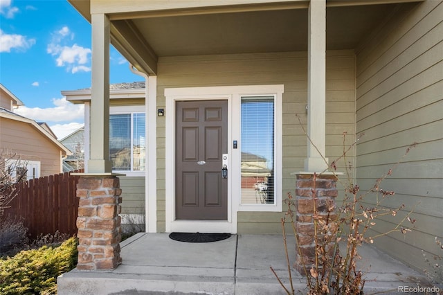 property entrance with fence