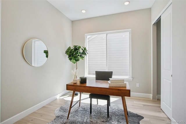 home office with light wood-type flooring