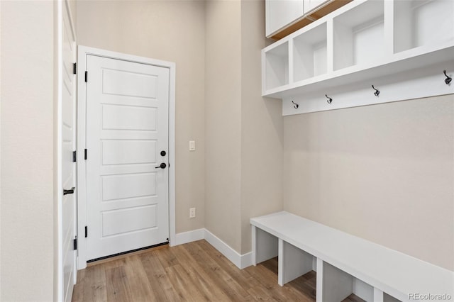 mudroom with baseboards and light wood-style floors