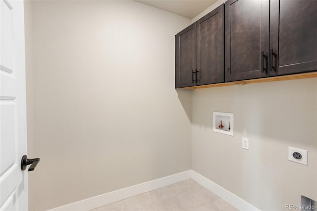 laundry room featuring baseboards, washer hookup, cabinet space, and hookup for an electric dryer