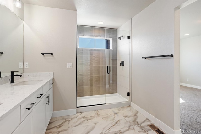 bathroom with vanity, visible vents, baseboards, marble finish floor, and a shower stall