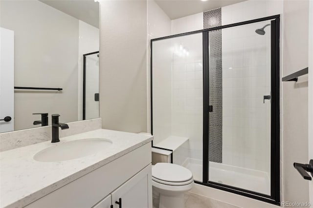 full bathroom featuring toilet, a stall shower, and vanity