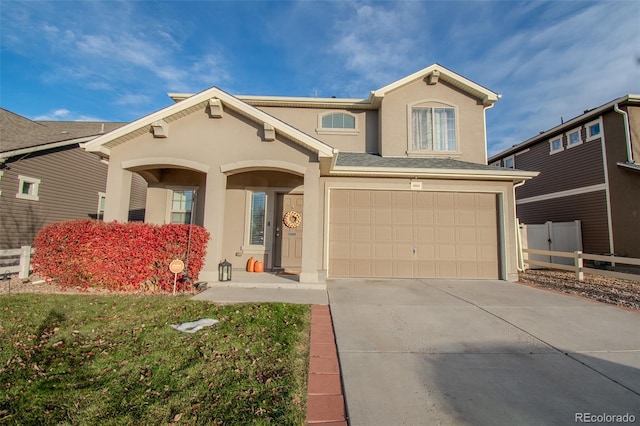 view of front of property with a garage