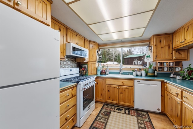 153 Gcr 135, Kremmling, CO 80459 - kitchen with backsplash, white appliances, and a sink