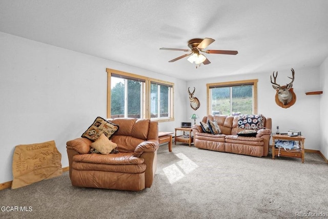 153 Gcr 135, Kremmling, CO 80459 - carpeted living room featuring baseboards and ceiling fan