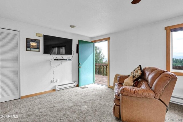 153 Gcr 135, Kremmling, CO 80459 - carpeted living room with visible vents, baseboards, and a baseboard radiator