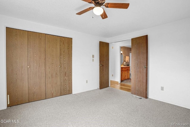 153 Gcr 135, Kremmling, CO 80459 - unfurnished bedroom with carpet, a closet, and a ceiling fan