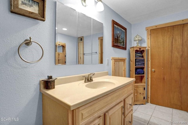 153 Gcr 135, Kremmling, CO 80459 - bathroom featuring tile patterned flooring, vanity, and a textured wall