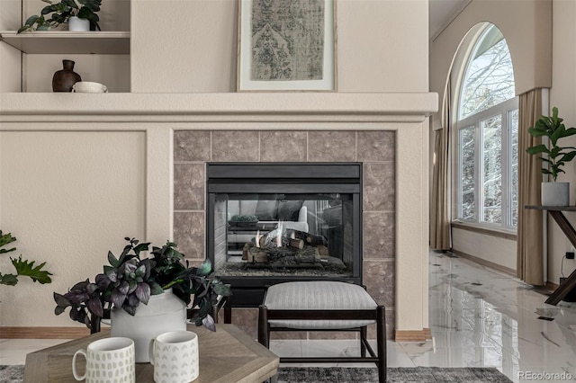 interior details with a tile fireplace