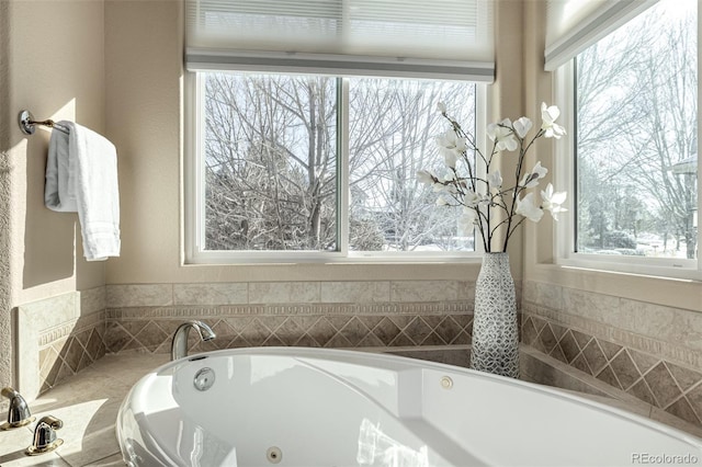 bathroom featuring tiled bath