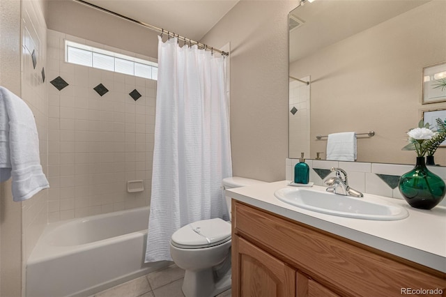 full bathroom featuring tile patterned flooring, vanity, toilet, and shower / bathtub combination with curtain