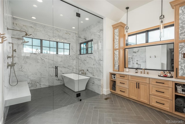 bathroom featuring tile walls, vanity, and plus walk in shower