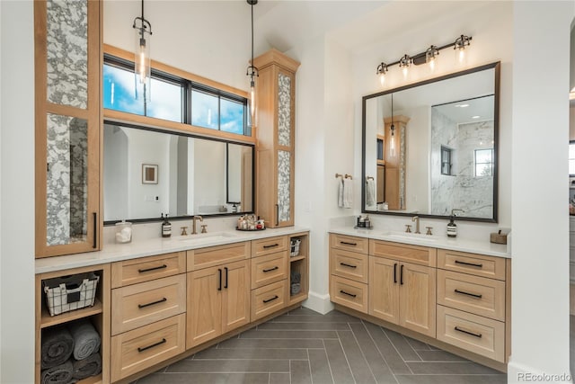 bathroom with vanity, tile patterned floors, and a tile shower